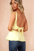 Khloe Yellow Bow Back Peplum Top
